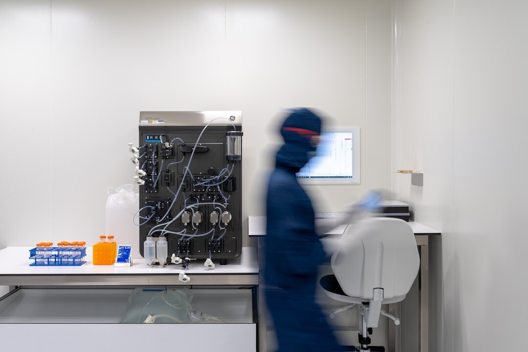 Advanced humanoid robot in a white research laboratory surrounded by scientific equipment