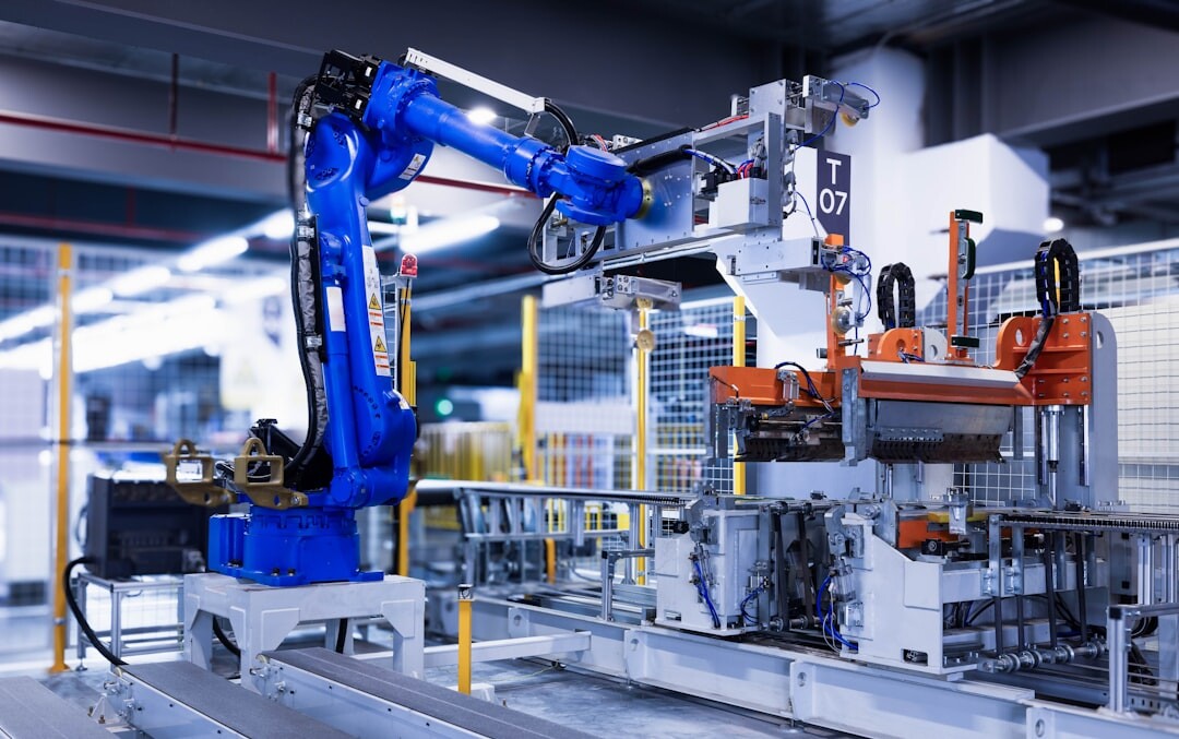 Industrial robotic arm working on an assembly line in a modern factory